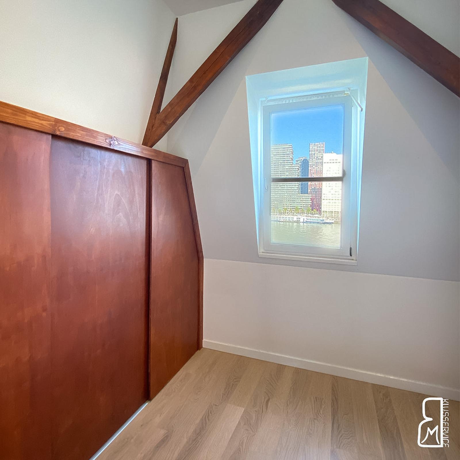 Teak closet matched to the attic structural beams