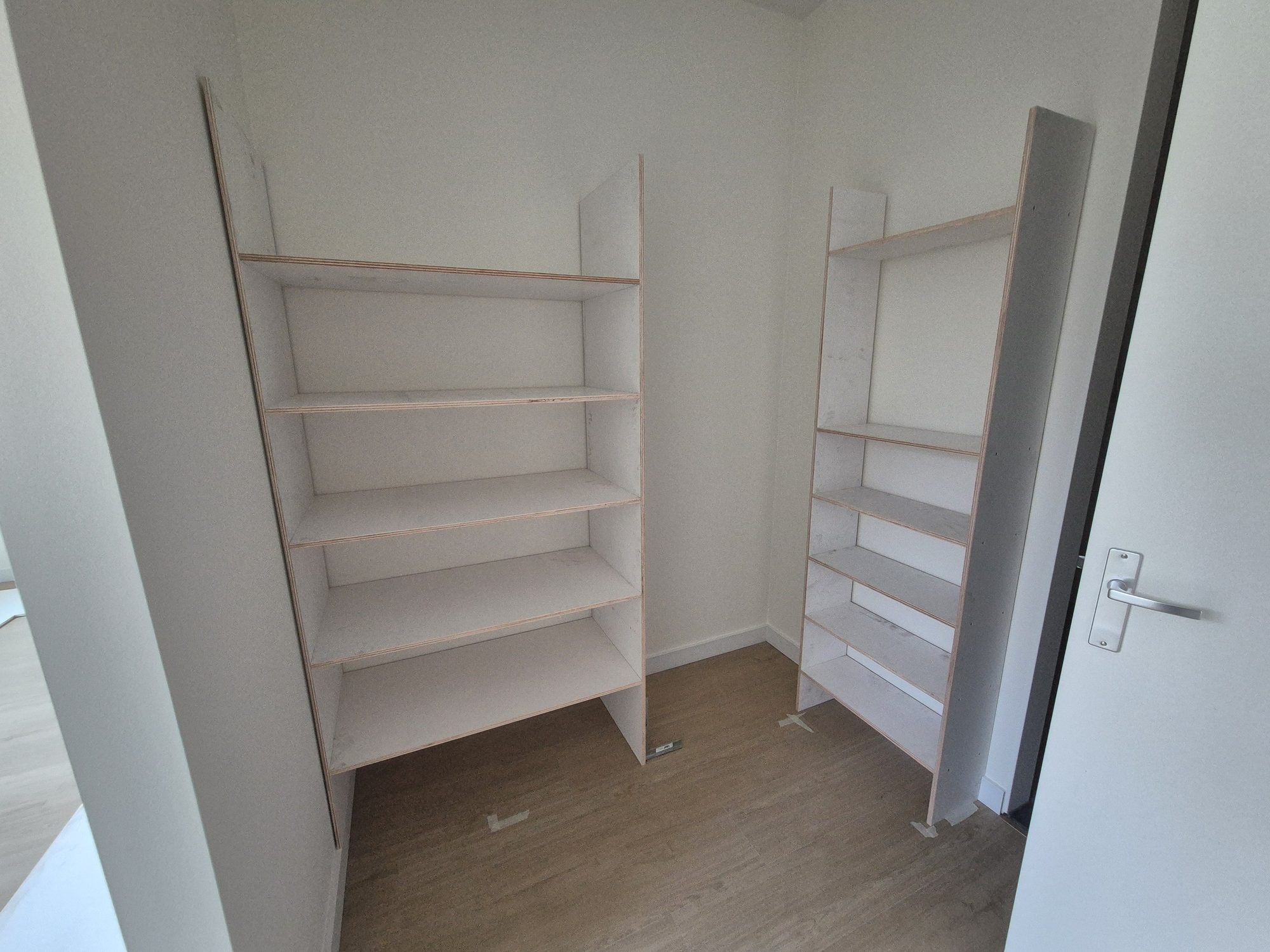 Finished cabinet with green doors and drawers